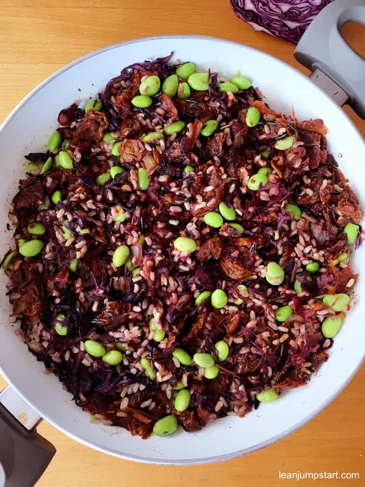 close up of fiber-rich edamame meal in a white skillet