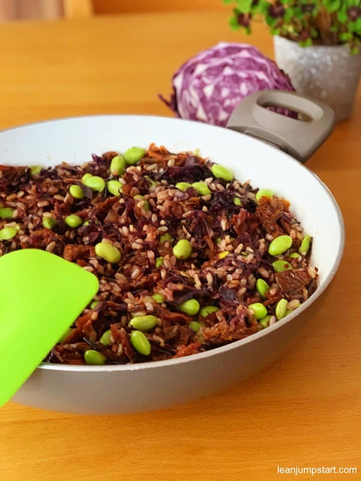 red cabbage stir fry with edamame in a skillet