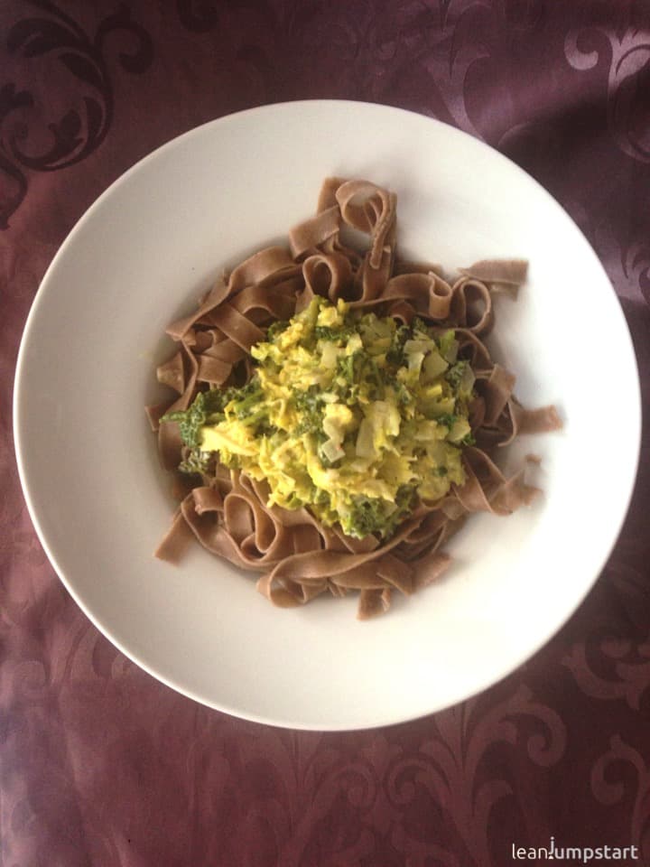 savoy cabbage whole grain noodles in a pasta plate