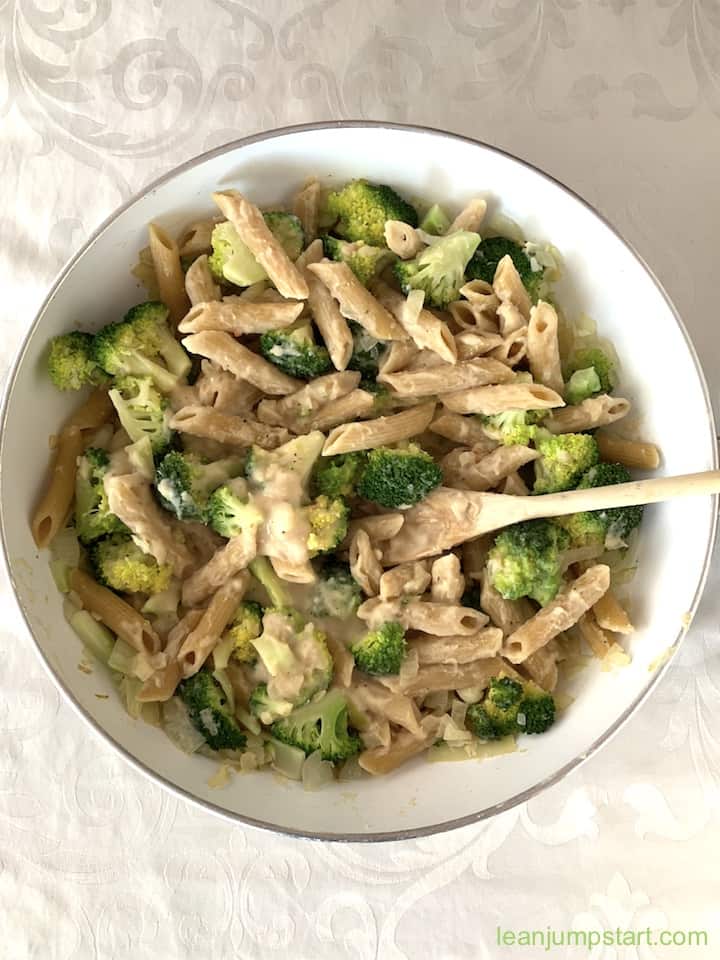 white bean pasta with broccoli in a skillet