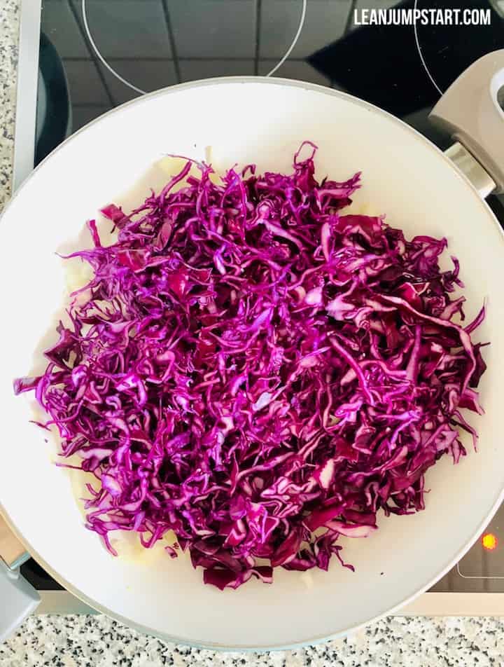 thinly sliced red cabbage in a pan