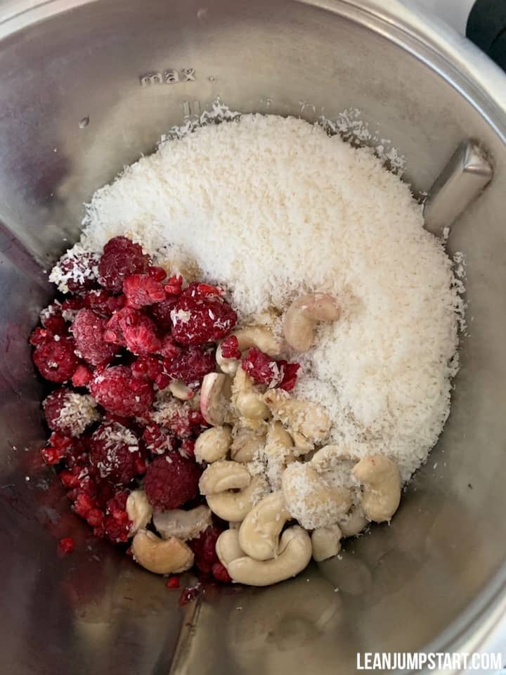 raspberries, cashews, coconut and maple syrup in food processor